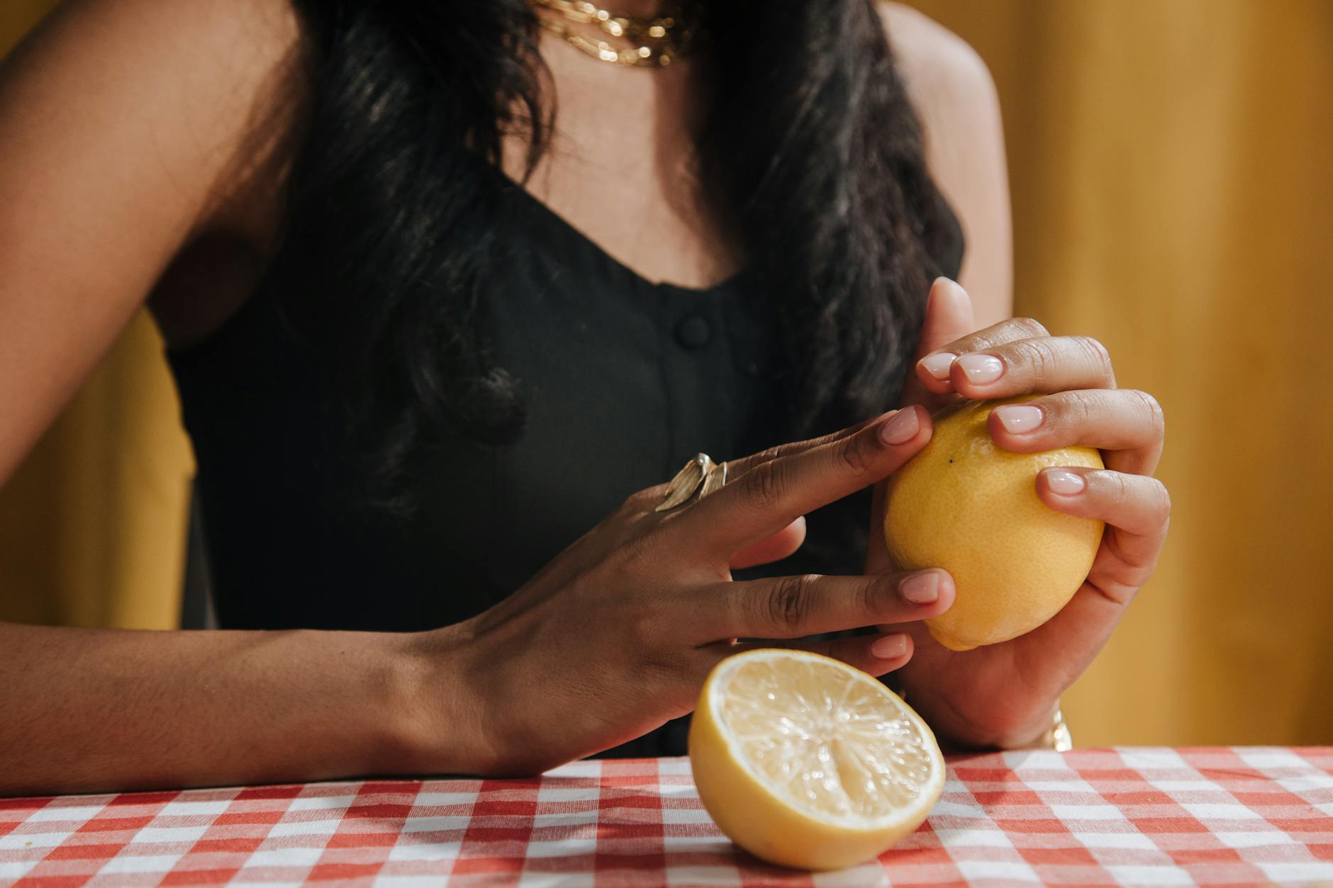 Bright yellow lemons arranged on a pastel background