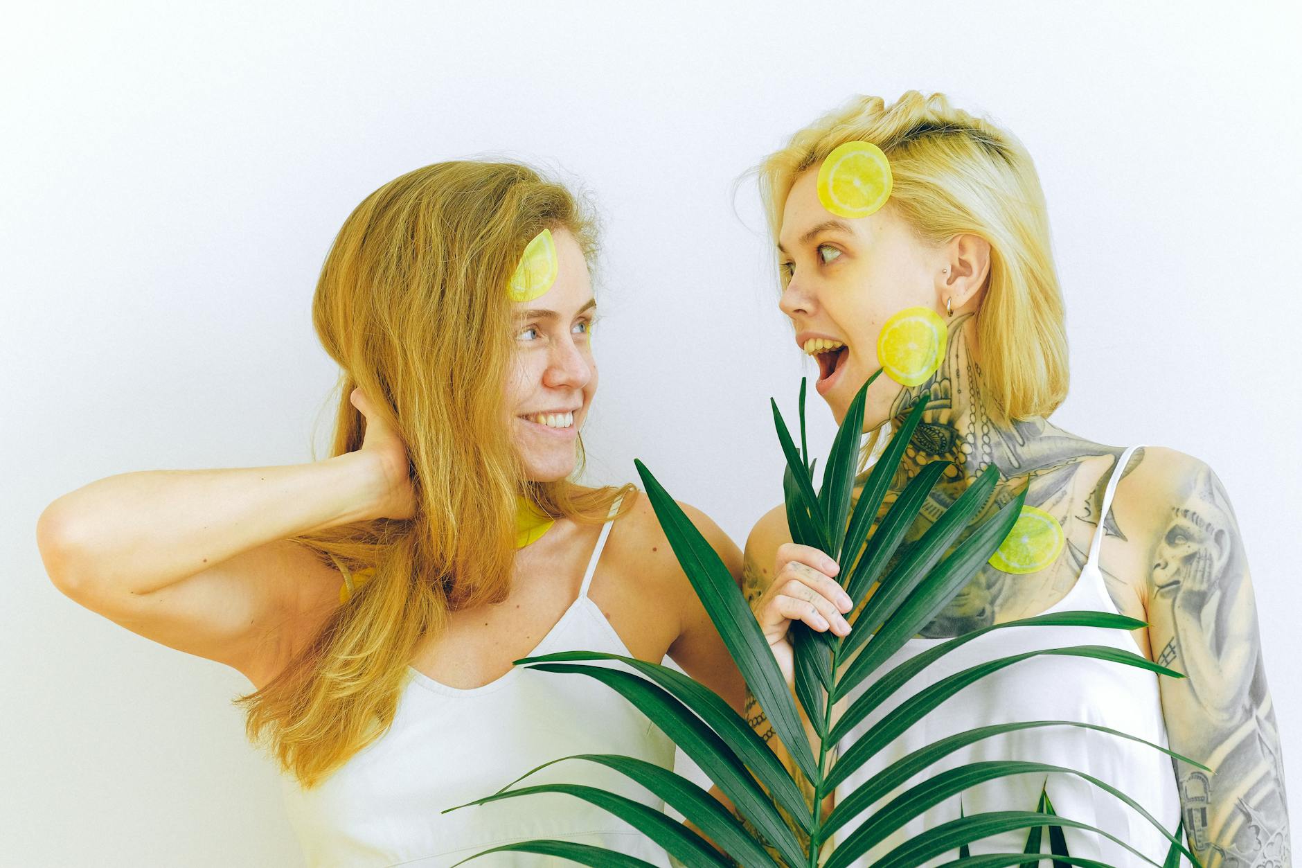 Two women laughing together indoors, expressing joy and connection