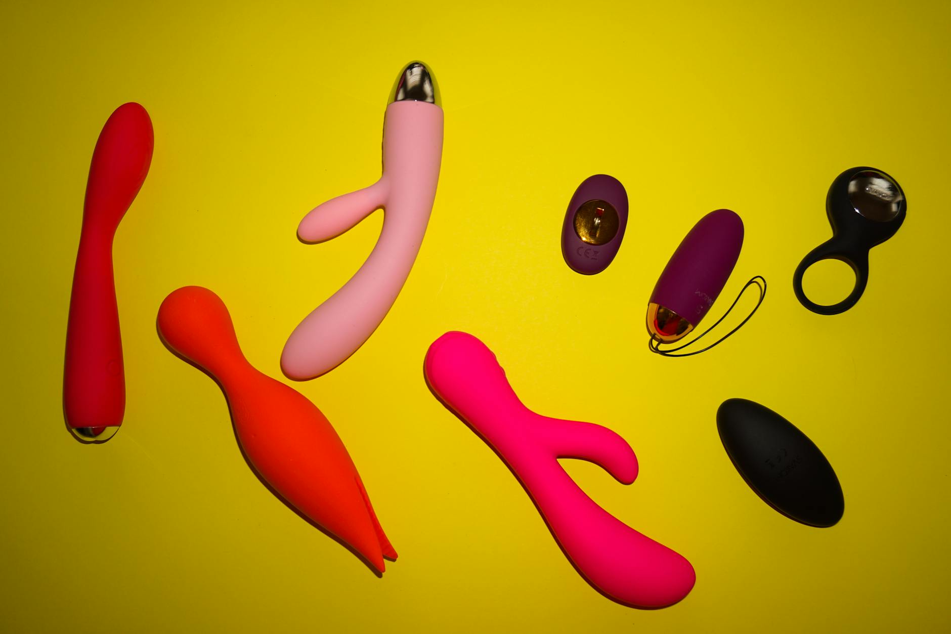 Close-up of hands holding a sleek vibrator, representing solo exploration and self-discovery